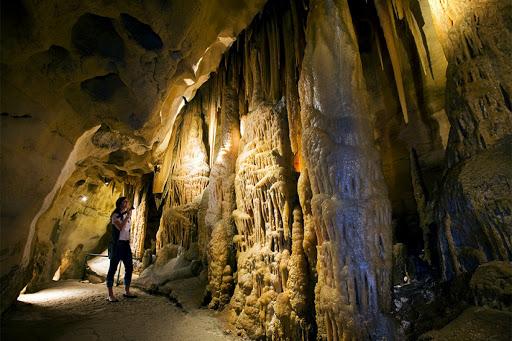 Golden limestone cave formations at Baratang Island